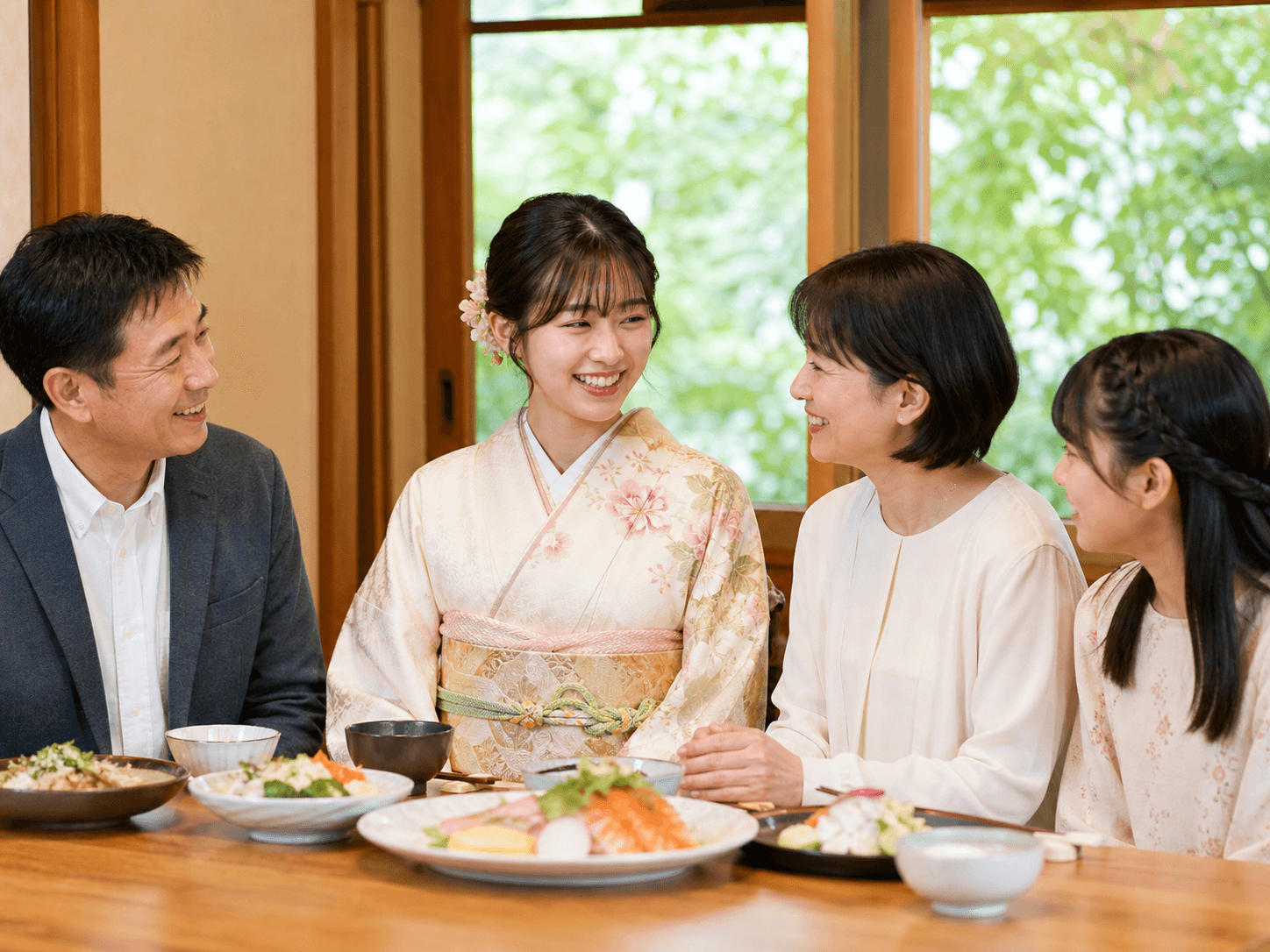 振袖で家族との食事を楽しむ様子